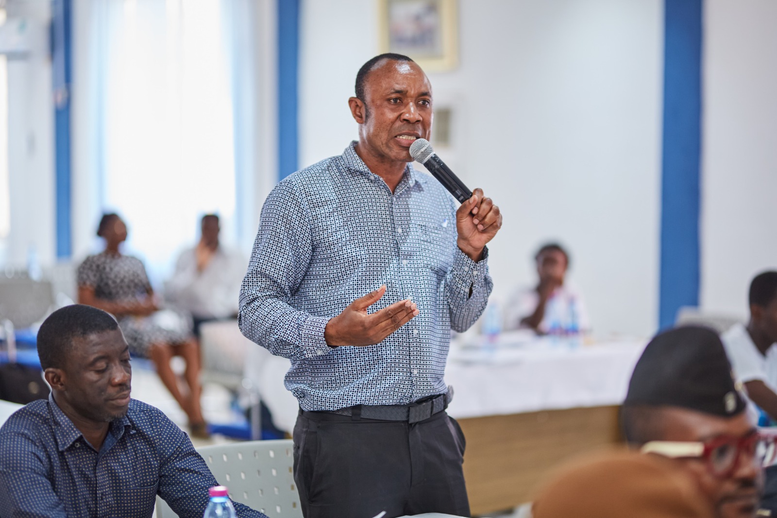 A community member speaking at a forum discussion